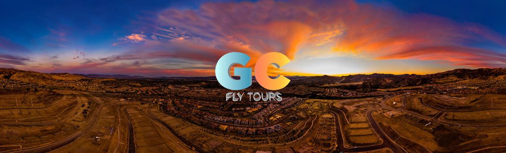 Get Community Fly Tours logo over an aerial panoramic view of a neighborhood with some home and lots of homesites with no construction